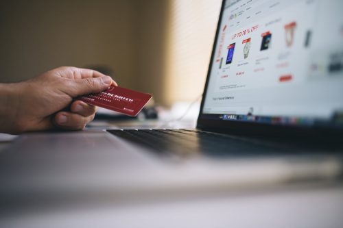 Man holding credit card for online shopping
